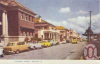 <span class="caption-caption">Victoria Street, Mackay</span>, c1956. <br />Postcard folder by <span class="caption-publisher">Murray Views Pty Ltd</span>, collection of <span class="caption-contributor">Centre for the Government of Queensland</span>.